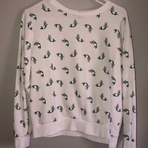 A long sleeve shirt with small mermaids